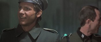 Movie still from “Hanover Street” (1979), directed by Peter Hyams – A person wearing a uniform; Close Up shot, Low angle