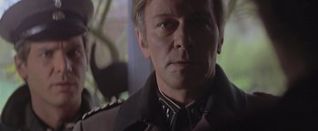 Movie still from “Hanover Street” (1979), directed by Peter Hyams – A person wearing a military uniform; Close Up shot, Low angle