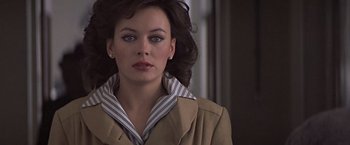 Movie still from “Hanover Street” (1979), directed by Peter Hyams – A person wearing a jacket; Close Up shot, Over the shoulder angle