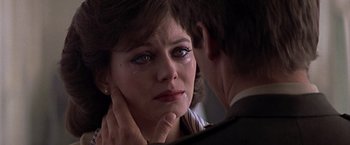 Movie still from “Hanover Street” (1979), directed by Peter Hyams – A woman is crying in front of a man; Close Up shot, Over the shoulder angle