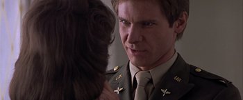 Movie still from “Hanover Street” (1979), directed by Peter Hyams – A person wearing a uniform; Close Up shot, Over the shoulder angle