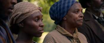 Movie still from “Harriet” (2019), directed by Kasi Lemmons – Two black women with headscarfs looking at the camera; Close Up shot, Over the shoulder angle