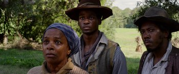 Movie still from “Harriet” (2019), directed by Kasi Lemmons – A man and a woman standing next to each other in a field; Close Up shot, Over the shoulder angle