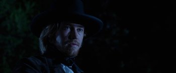 Movie still from “Harriet” (2019), directed by Kasi Lemmons – A man with a beard wearing a black hat; Close Up shot, Low angle