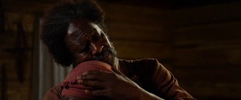Movie still from “Harriet” (2019), directed by Kasi Lemmons – An older man holding a basketball in his hands; Close Up shot, Over the shoulder angle