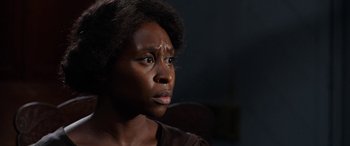 Movie still from “Harriet” (2019), directed by Kasi Lemmons – An african american woman looking into the distance; Close Up shot, Over the shoulder angle