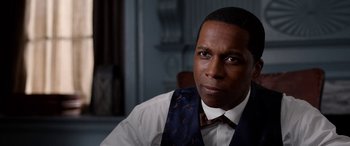 Movie still from “Harriet” (2019), directed by Kasi Lemmons – A person wearing a vest and a tie; Close Up shot, Over the shoulder angle