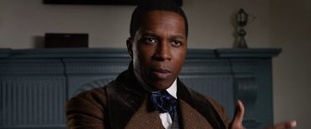 Movie still from “Harriet” (2019), directed by Kasi Lemmons – A person wearing a suit and tie; Close Up shot, High angle