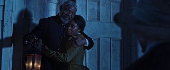 Movie still from “Harriet” (2019), directed by Kasi Lemmons – An older man and a younger woman hugging; Medium shot, Over the shoulder angle