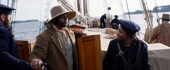 Movie still from “Harriet” (2019), directed by Kasi Lemmons – A man and a woman standing next to each other on a boat; Medium shot, Over the shoulder angle