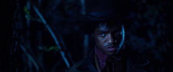 Movie still from “Harriet” (2019), directed by Kasi Lemmons – A man in a hat and a tie; Close Up shot, Low angle