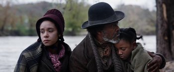 Movie still from “Harriet” (2019), directed by Kasi Lemmons – An older man and two young women in a park; Close Up shot, Over the shoulder angle