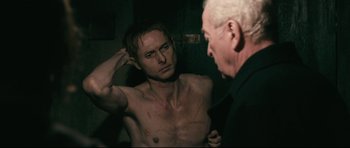Movie still from “Harry Brown” (2009), directed by Daniel Barber – A man looking at himself in the mirror; Medium shot, Over the shoulder angle