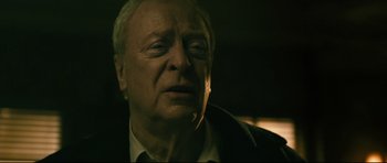 Movie still from “Harry Brown” (2009), directed by Daniel Barber – An older man is looking up at the sky; Close Up shot, Low angle