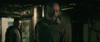 Movie still from “Harry Brown” (2009), directed by Daniel Barber – A man with a beard wearing a brown sweater; Close Up shot, Low angle
