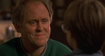 Movie still from “Harry and the Hendersons” (1987), directed by William Dear – A person talking to another person; Close Up shot, Over the shoulder angle