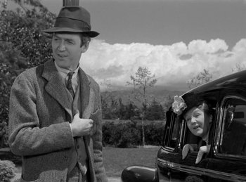 Movie still from “Harvey” (1950), directed by Henry Koster – An old photo of a man and a girl in a car; Medium shot, Low angle