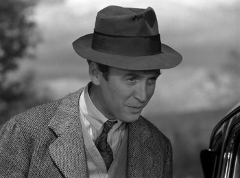 Movie still from “Harvey” (1950), directed by Henry Koster – A man wearing a suit and a hat; Close Up shot, Over the shoulder angle