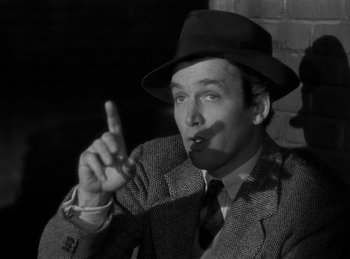 Movie still from “Harvey” (1950), directed by Henry Koster – A black and white photo of a man wearing a hat; Close Up shot, Low angle