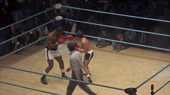 Movie still from “Head” (1968), directed by Bob Rafelson – Two boxers in a boxing ring during a match; Wide shot, High angle