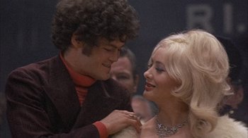 Movie still from “Head” (1968), directed by Bob Rafelson – A man and a woman are smiling at each other; Close Up shot, Low angle