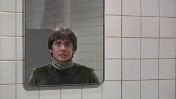 Movie still from “Head” (1968), directed by Bob Rafelson – A man is reflected in a bathroom mirror; Close Up shot, Over the shoulder angle
