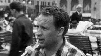 Movie still from “Head” (1968), directed by Bob Rafelson – Black and white photograph of a man in a plaid shirt; Close Up shot, Low angle