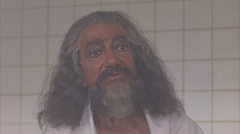 Movie still from “Head” (1968), directed by Bob Rafelson – An old man with long grey hair and a beard; Close Up shot, Low angle