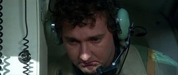 Movie still from “Heartbeeps” (1981), directed by Allan Arkush – A person wearing a headset; Close Up shot, Low angle