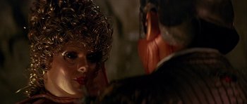 Movie still from “Heartbeeps” (1981), directed by Allan Arkush – A person wearing a wig; Close Up shot, Over the shoulder angle