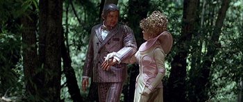 Movie still from “Heartbeeps” (1981), directed by Allan Arkush – A man and a woman dressed up in costumes; Medium shot, Low angle