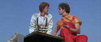 Movie still from “Heartbeeps” (1981), directed by Allan Arkush – A man and a woman talking to each other; Medium shot, Low angle