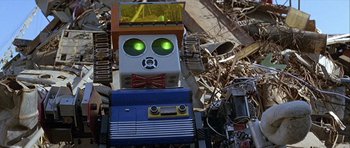 Movie still from “Heartbeeps” (1981), directed by Allan Arkush – An old radio with a green light on top of it; Medium shot, Low angle