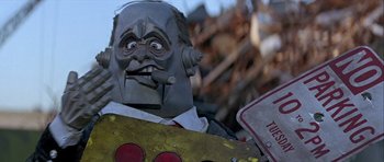 Movie still from “Heartbeeps” (1981), directed by Allan Arkush – A man's face with a cigarette in his mouth; Close Up shot, Low angle