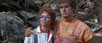 Movie still from “Heartbeeps” (1981), directed by Allan Arkush – A man and a woman standing next to each other; Medium shot, Low angle