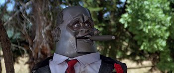 Movie still from “Heartbeeps” (1981), directed by Allan Arkush – A person wearing a suit and tie; Close Up shot, Low angle