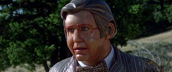 Movie still from “Heartbeeps” (1981), directed by Allan Arkush – The face of a statue of a man; Close Up shot, Low angle