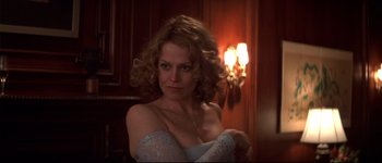 Movie still from “Heartbreakers” (2001), directed by David Mirkin – A woman with curly hair wearing a white dress; Close Up shot, Over the shoulder angle