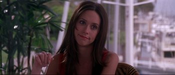 Movie still from “Heartbreakers” (2001), directed by David Mirkin – A person sitting in a chair; Close Up shot, Over the shoulder angle