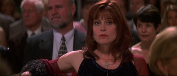 Movie still from “Heartbreakers” (2001), directed by David Mirkin – A person sitting in a room; Close Up shot, Over the shoulder angle