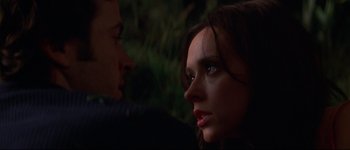 Movie still from “Heartbreakers” (2001), directed by David Mirkin – A man and a woman face to face in the dark; Close Up shot, Over the shoulder angle