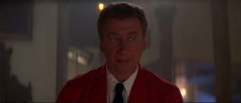 Movie still from “Heartbreakers” (2001), directed by David Mirkin – A person wearing a suit and tie; Close Up shot, Low angle