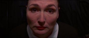 Movie still from “Heartbreakers” (2001), directed by David Mirkin – A person's eyes and face; Close Up shot, Overhead angle