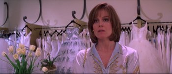 Movie still from “Heartbreakers” (2001), directed by David Mirkin – A person wearing a dress; Close Up shot, Over the shoulder angle