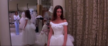 Movie still from “Heartbreakers” (2001), directed by David Mirkin – A beautiful young woman in a wedding dress; Medium shot, Over the shoulder angle