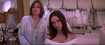 Movie still from “Heartbreakers” (2001), directed by David Mirkin – A woman and a woman in a wedding dress; Close Up shot, Over the shoulder angle