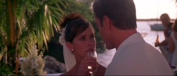 Movie still from “Heartbreakers” (2001), directed by David Mirkin – A man and a woman drinking champagne in front of a body of water; Close Up shot, Over the shoulder angle
