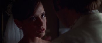 Movie still from “Heartbreakers” (2001), directed by David Mirkin – A woman's face in the dark; Close Up shot, Over the shoulder angle