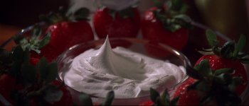 Movie still from “Heartbreakers” (2001), directed by David Mirkin – A bowl of whipped cream on the table; Extreme Close Up shot, High angle