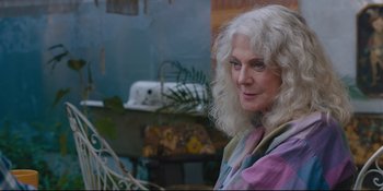 Movie still from “Hearts Beat Loud” (2018), directed by Brett Haley – An older woman with long white curly hair; Close Up shot, Over the shoulder angle